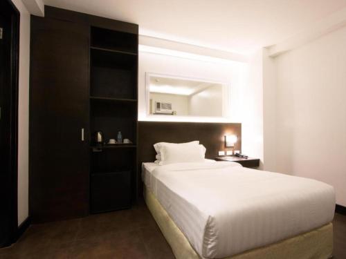 Postel nebo postele na pokoji v ubytování Hotel Fina