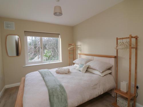 Ένα ή περισσότερα κρεβάτια σε δωμάτιο στο Wood Beach Lodge