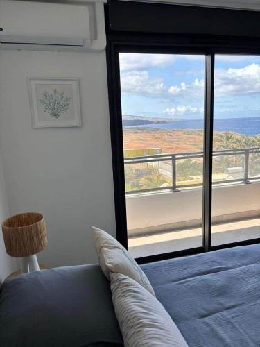 Postel nebo postele na pokoji v ubytování Appartements sur le littoral TROIS BASSINS
