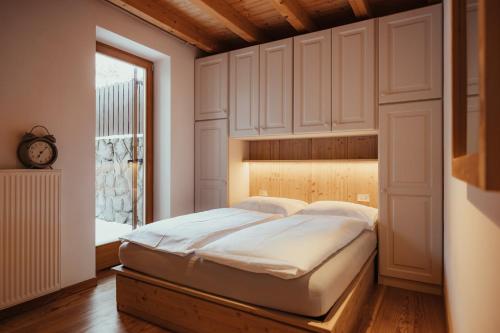 a bedroom with a large bed in a room at Stella Due in Arabba