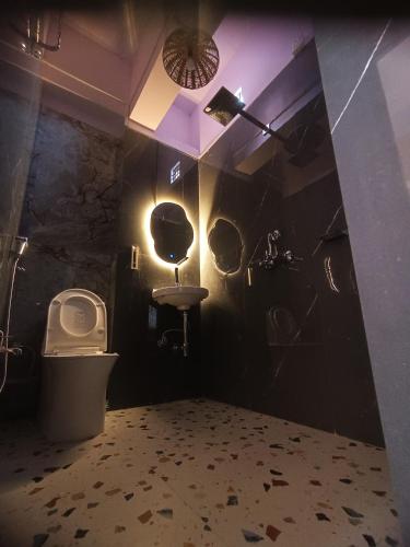 a bathroom with a sink and a toilet at Sukoon River Homestay in Varanasi