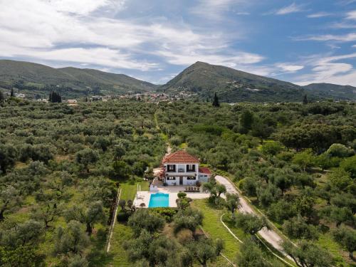 an aerial view of a house in the hills at Villa Lola - 3 Bedrooms & Private Pool in Lithakia