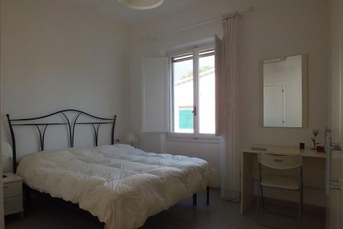 Postel nebo postele na pokoji v ubytování Golden River n6 Marina di Campo