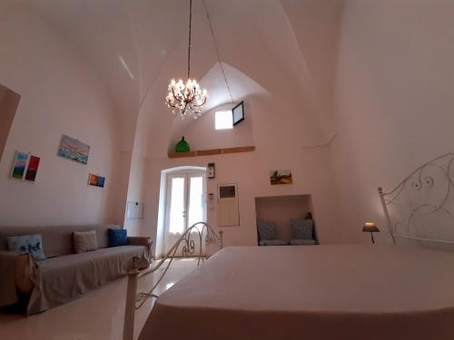 En eller flere senge i et værelse på Casa dei Fiori