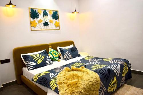 Ένα ή περισσότερα κρεβάτια σε δωμάτιο στο The Cozy Nook- 2BHK