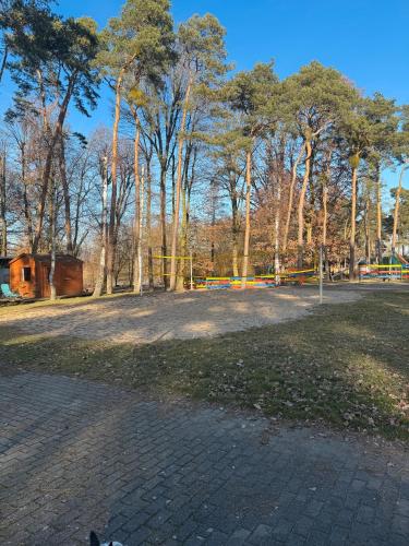 a park with a lot of trees in the background at La Pura Vida - Glamping in Brandenburg an der Havel