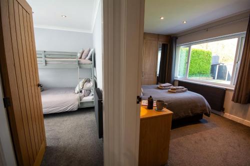 a small room with a bed and a window at 80 Breeze Hill in Benllech