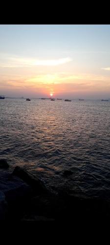 a sunset over a large body of water at Dscondo in Ban Map Chalut
