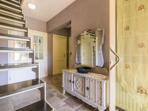 a bathroom with a sink and a mirror on the wall at Modern holiday home in Aquitaine in Saint-Nexans