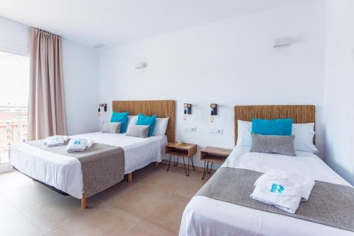 Postel nebo postele na pokoji v ubytování Bamblue Boutique Apartments