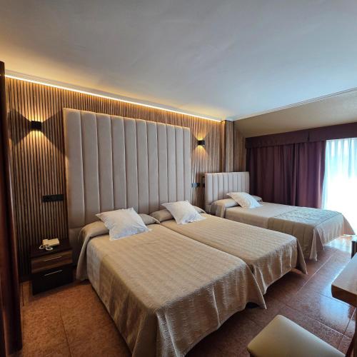 Postel nebo postele na pokoji v ubytování Hotel Gala