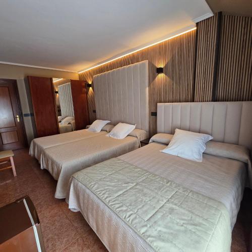 Postel nebo postele na pokoji v ubytování Hotel Gala