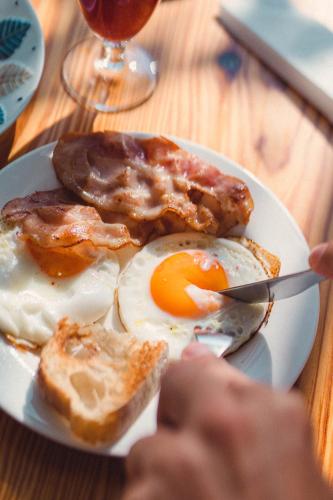 a plate of breakfast food with eggs and toast at Hotel A Miranda in Feás