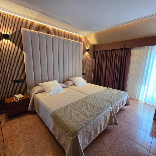 Postel nebo postele na pokoji v ubytování Hotel Gala