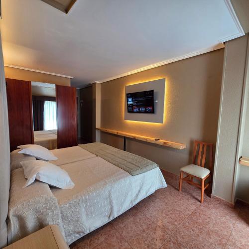 Postel nebo postele na pokoji v ubytování Hotel Gala
