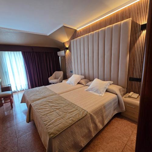 Postel nebo postele na pokoji v ubytování Hotel Gala
