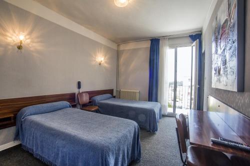Postel nebo postele na pokoji v ubytování Hôtel Sampiero Corso