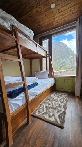 Giường trong phòng chung tại Norden Cottage - The Alpinist