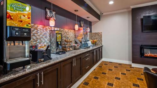 a bar in a restaurant with a counter at SureStay Hotel by Best Western Terrell in Terrell
