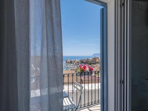 a window with a view of a beach and the ocean at Tannur B&B in Castellammare del Golfo