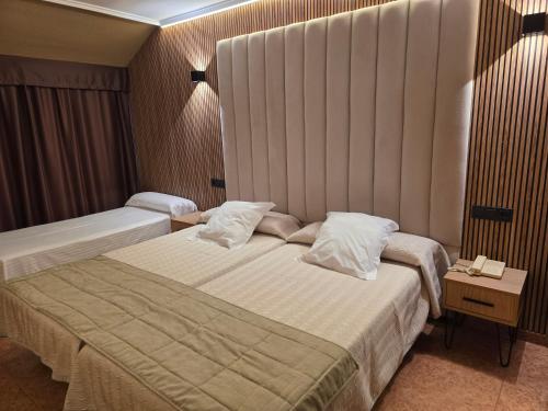 Postel nebo postele na pokoji v ubytování Hotel Gala