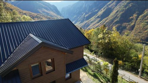 a house with a view of a mountain at Villa Troi in Mazgit