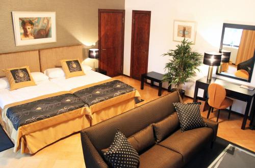 Postel nebo postele na pokoji v ubytování Art Hostel Honkahovi