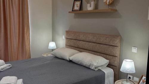 Ένα ή περισσότερα κρεβάτια σε δωμάτιο στο Johnhara Studios & Apartments 