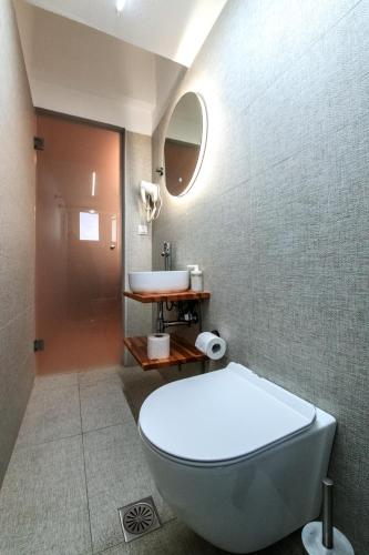 a bathroom with a toilet and a sink at Preveza Central Stay in Preveza