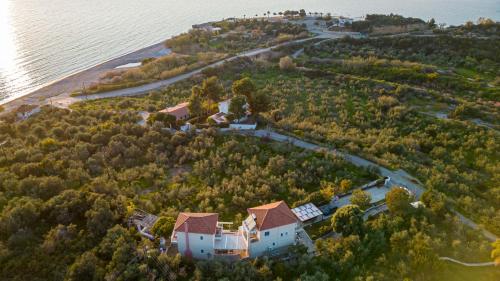 an aerial view of a house on an island in the water at Ridomo Sea View Villas Camellia & Jasmine in Avia