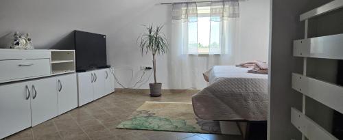 Ένα ή περισσότερα κρεβάτια σε δωμάτιο στο Vila Jenny