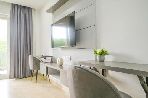 a dining room with a table and chairs at Housr Sector 28 Gurgaon Near IFFCO Chowk Metro Station in Gurgaon