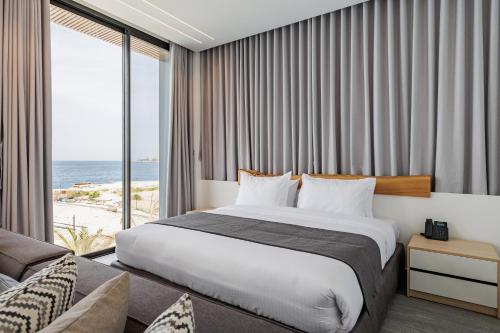 Ένα ή περισσότερα κρεβάτια σε δωμάτιο στο Middle Beach Hotel