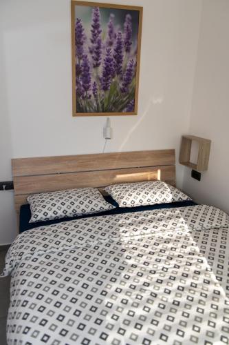 Postel nebo postele na pokoji v ubytování Apartments Pr' Užlejbvih