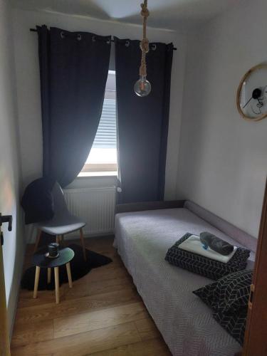 Ένα ή περισσότερα κρεβάτια σε δωμάτιο στο Apartman Matea