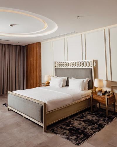 a bedroom with a large bed in a room at Villa Misk Alkhobar in Al Khobar