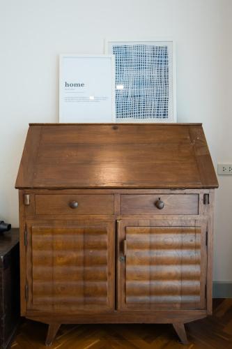 a wooden dresser in a room with a window at Ang Kaew Pool Villa 4BR 5 Min Drive to Nimmanhemin in Chiang Mai
