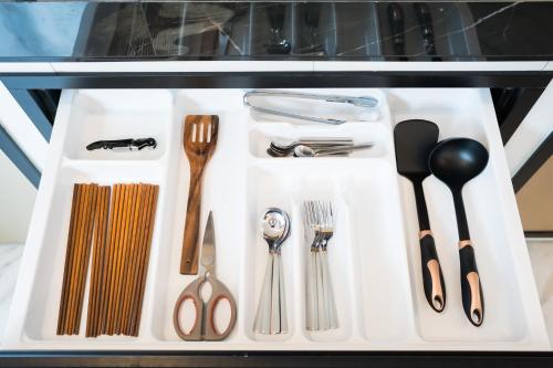 a group of utensils sitting on a white tray at Ang Kaew Pool Villa 4BR 5 Min Drive to Nimmanhemin in Chiang Mai