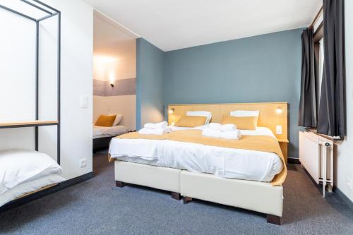 Postel nebo postele na pokoji v ubytování Hotel Montovani