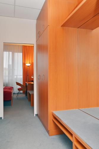 Postel nebo postele na pokoji v ubytování Avanti Hotel