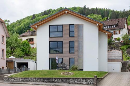 a white house with a brown roof at Wanderlust in Todtnau