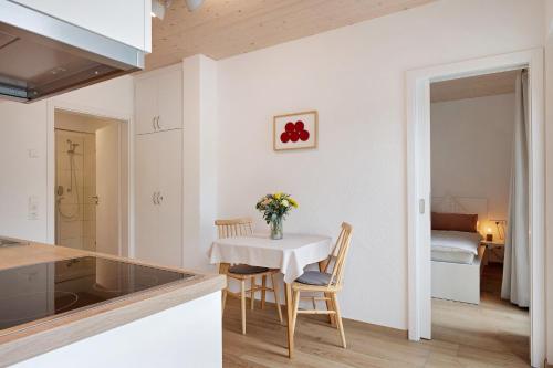 a kitchen and dining room with a table and chairs at Wanderlust in Todtnau