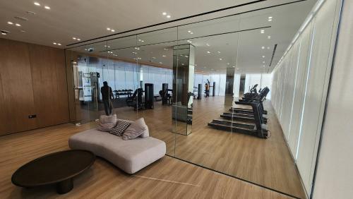 a living room with a couch and a table at Disalvo Smart and Luxury Studio in Dubai