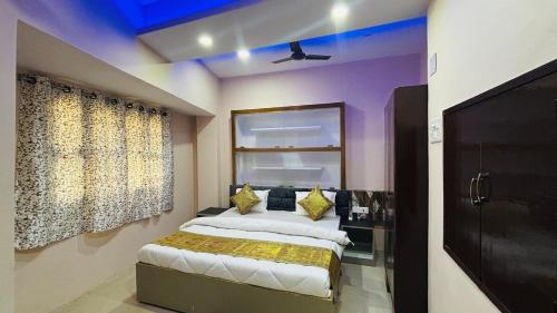 a bedroom with a bed with yellow pillows at Spiritual Homestay in Varanasi