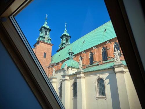 a view of a building with a green roof at Adalbertus Dom Pielgrzyma in Gniezno