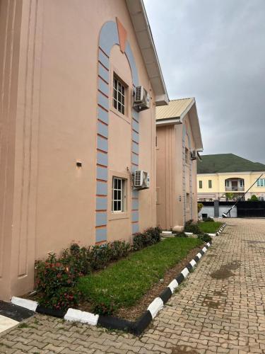a building with an arch on the side of it at Serviced Apartment Direct in Abuja