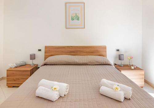 Giường trong phòng chung tại -Cavour 4- 2 Bedrooms near the Leaning Tower