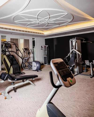 a gym with treadmills and elliptical machines at Villa Misk Alkhobar in Al Khobar