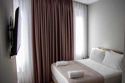 Postel nebo postele na pokoji v ubytování Santa Maria, Vila Cerloj