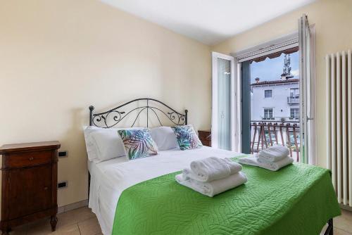 En eller flere senge i et værelse på Apt Amè Peschiera del Garda